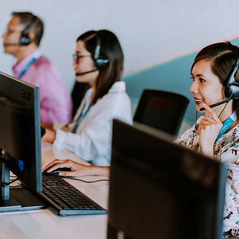 3 Employees Working Enthusiastically in a Building