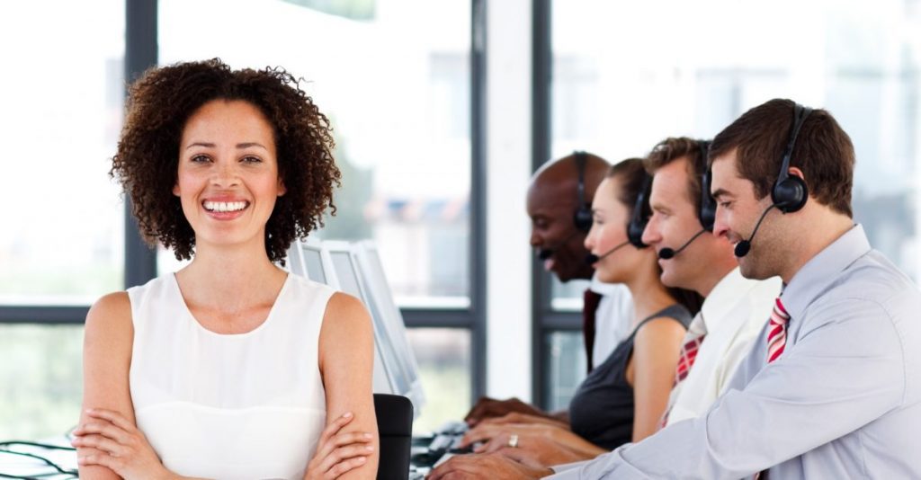 Call Center Team Leader A Team Leader smiling before her team of Call Center Agents
