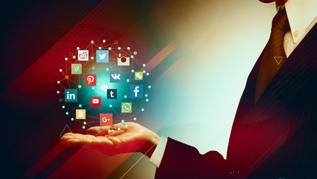 a hand holding some digital marketing and social media icons