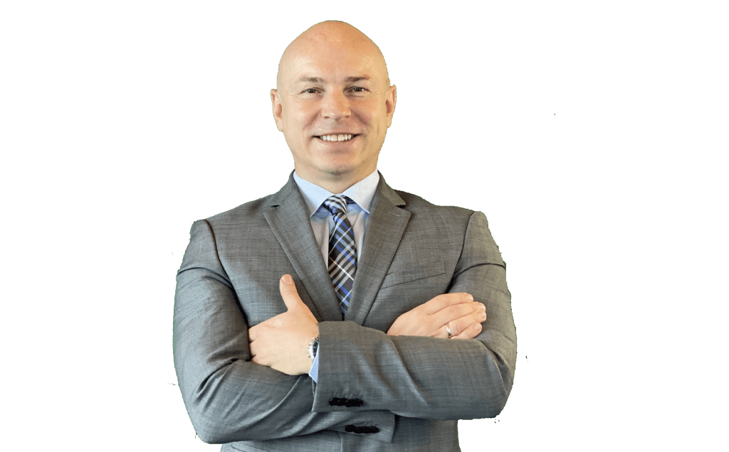 George Strnad, COO of iSuporta A smiling American BPO businessman in a suit at isuporta