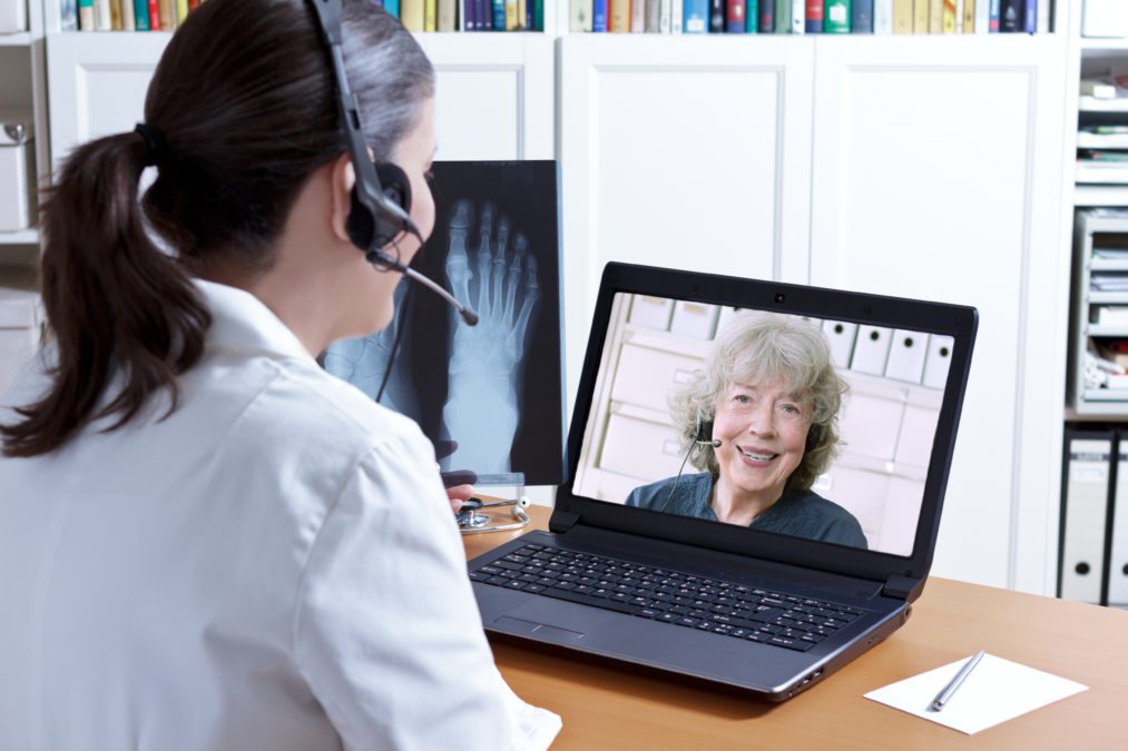 telehealth medical practitioner speaking with a patient in a laptop